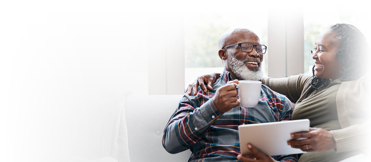 Man woman on couch laughing